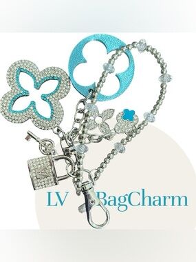 LV (Auth/Stamped)Silver Lock Bling charm w/Blue & Silver Clovers. Original. NEW